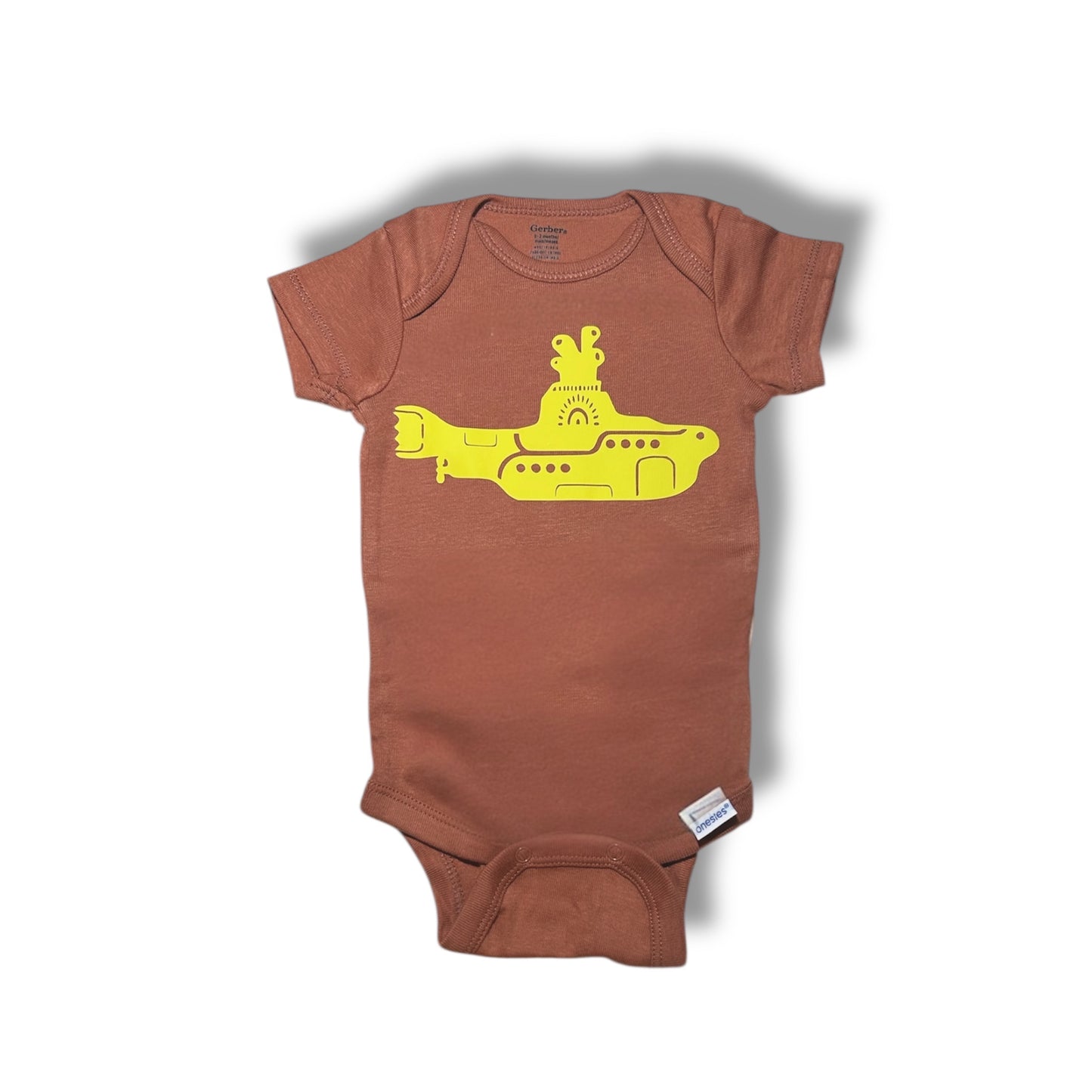 Beatles Baby Gift Box featuring a brown onesie with a yellow submarine graphic for music lovers.