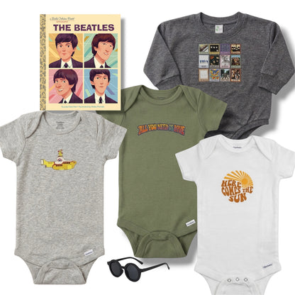 Collection of baby clothing and accessories with Beatles-themed designs on a white background