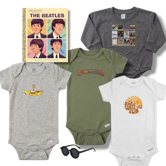 Collection of baby clothing and accessories with Beatles-themed designs on a white background