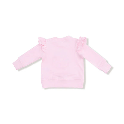Pink long-sleeve top with ruffled shoulders on a white background