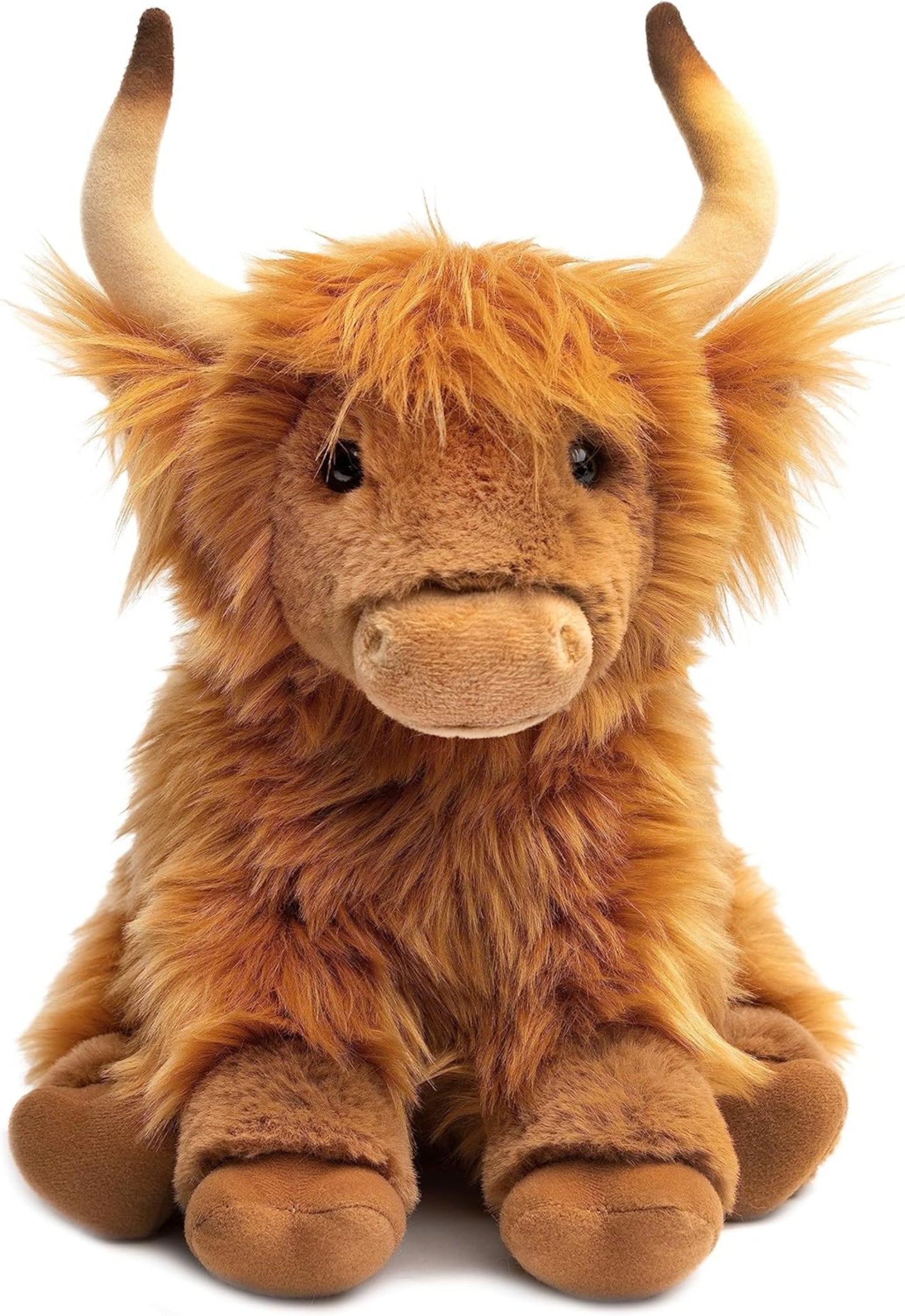 Plush toy highland cow on a white background
