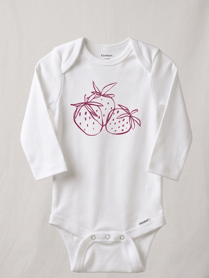 White baby onesie with pink strawberry design on a light gray background