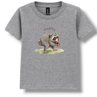 A heather gray short-sleeve crewneck t-shirt featuring a watercolor-style graphic of a raccoon holding an acorn with the name 'jimothy' printed above it, displayed on a clean white background.