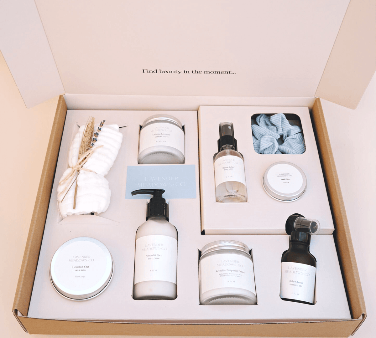 Set of skincare products in a box with text 'Find beauty in the moment'.