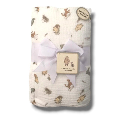 Baby blanket with animal pattern and wooden tag on a white background