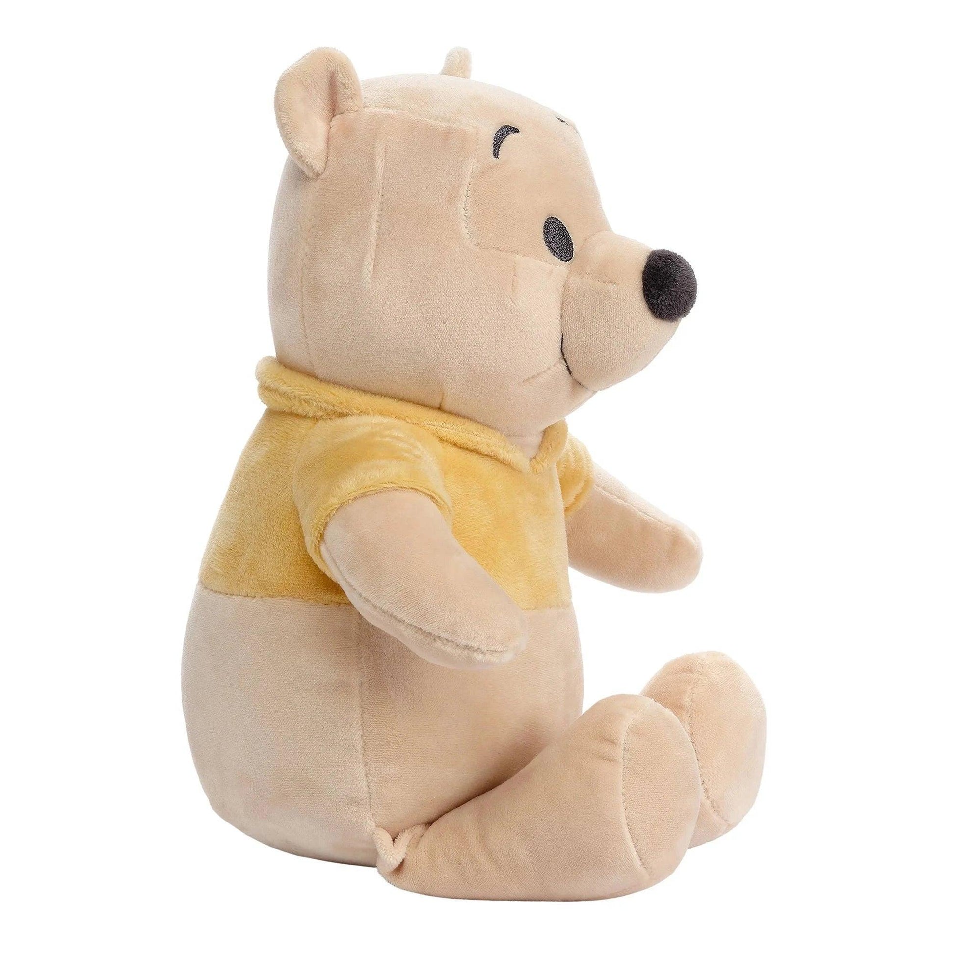 Plush bear toy with a yellow shirt on a white background