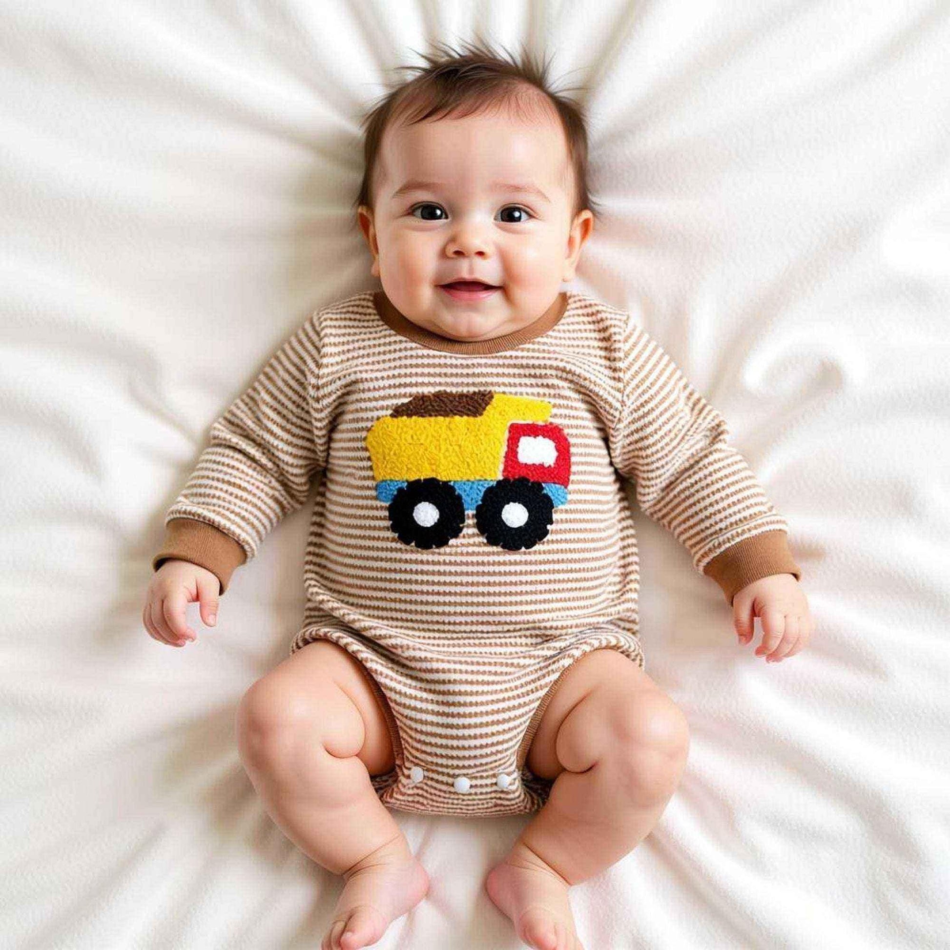 Baby in striped onesie with colorful truck design, perfect for baby showers and themed gifts