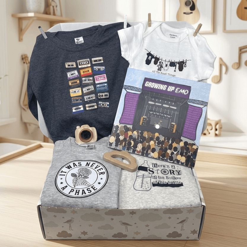 Box of t-shirts with graphic designs in a room with guitars and plants