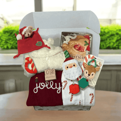 Festive baby gift box with Santa hat, plush toys, holiday-themed socks, and a Christmas book for 2 months old.