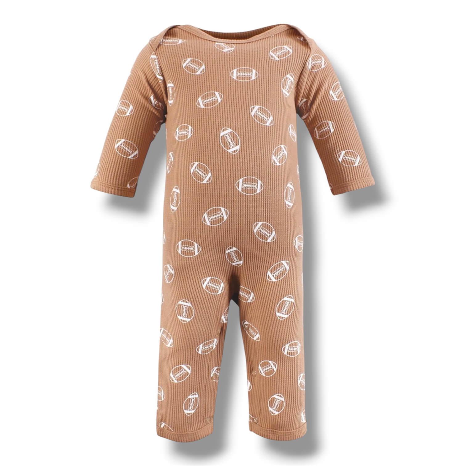 Brown baby onesie with white pattern on a white background