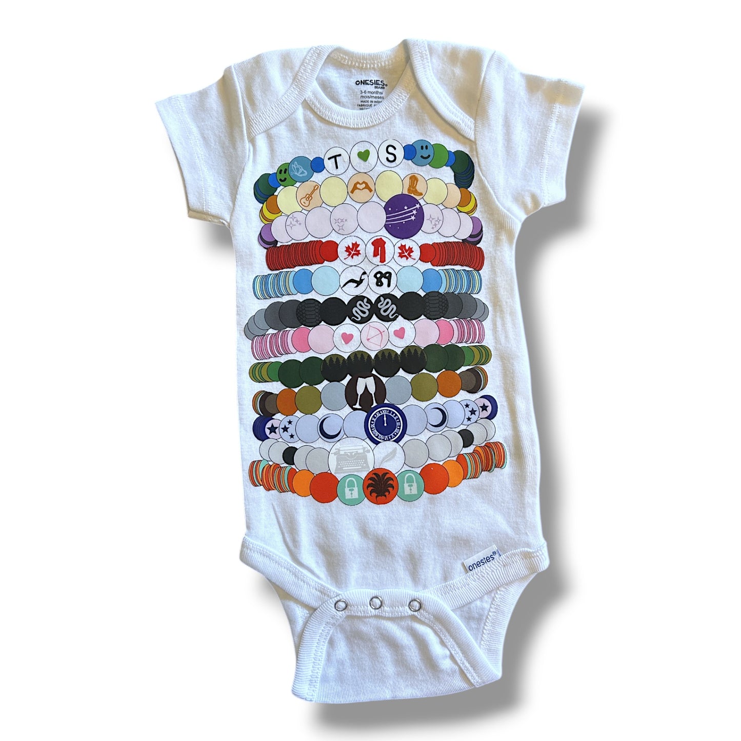 White baby onesie with colorful graphic design on a white background