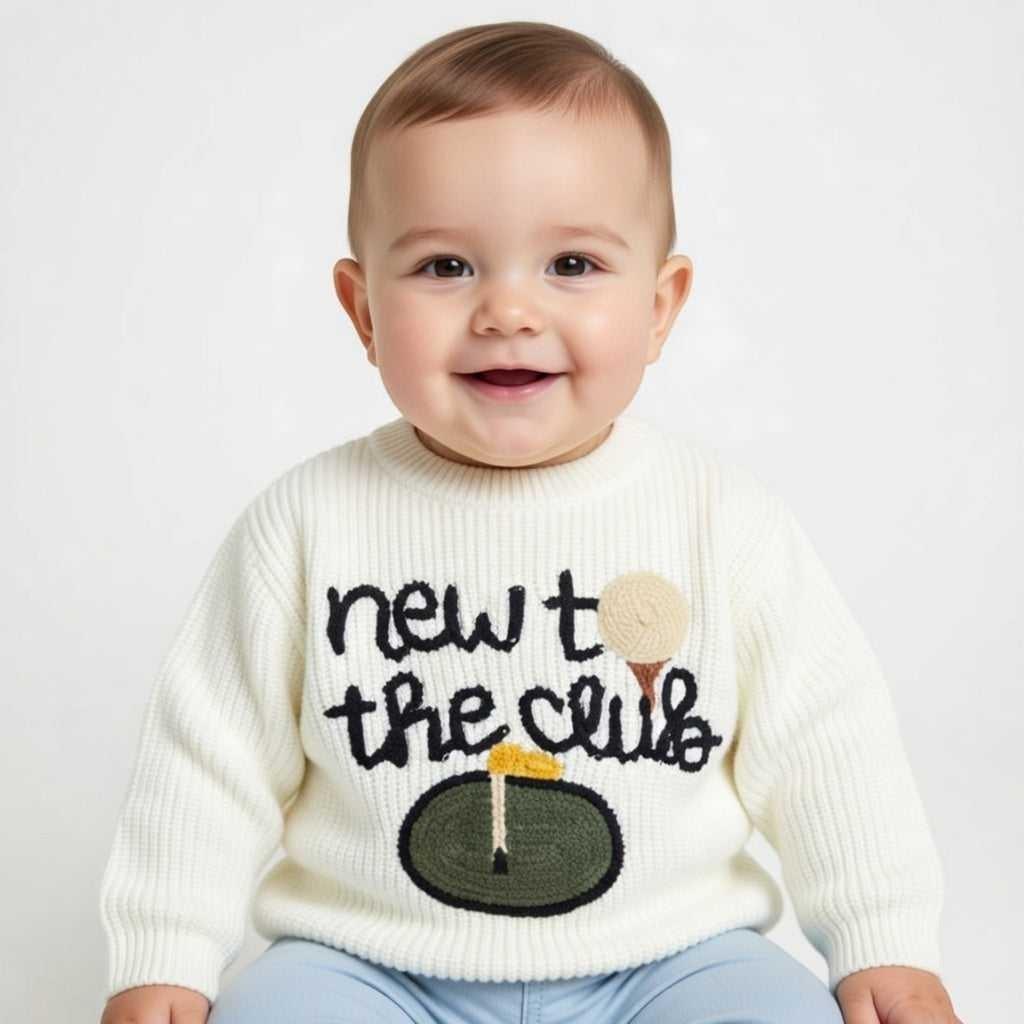 Hey Baby Box cream knit sweater with "new to the club" text and golf ball on tee embroidery.