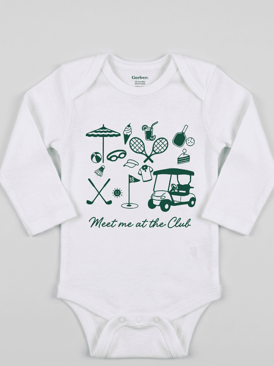 White baby onesie with green golf-themed graphics and text on a light gray background