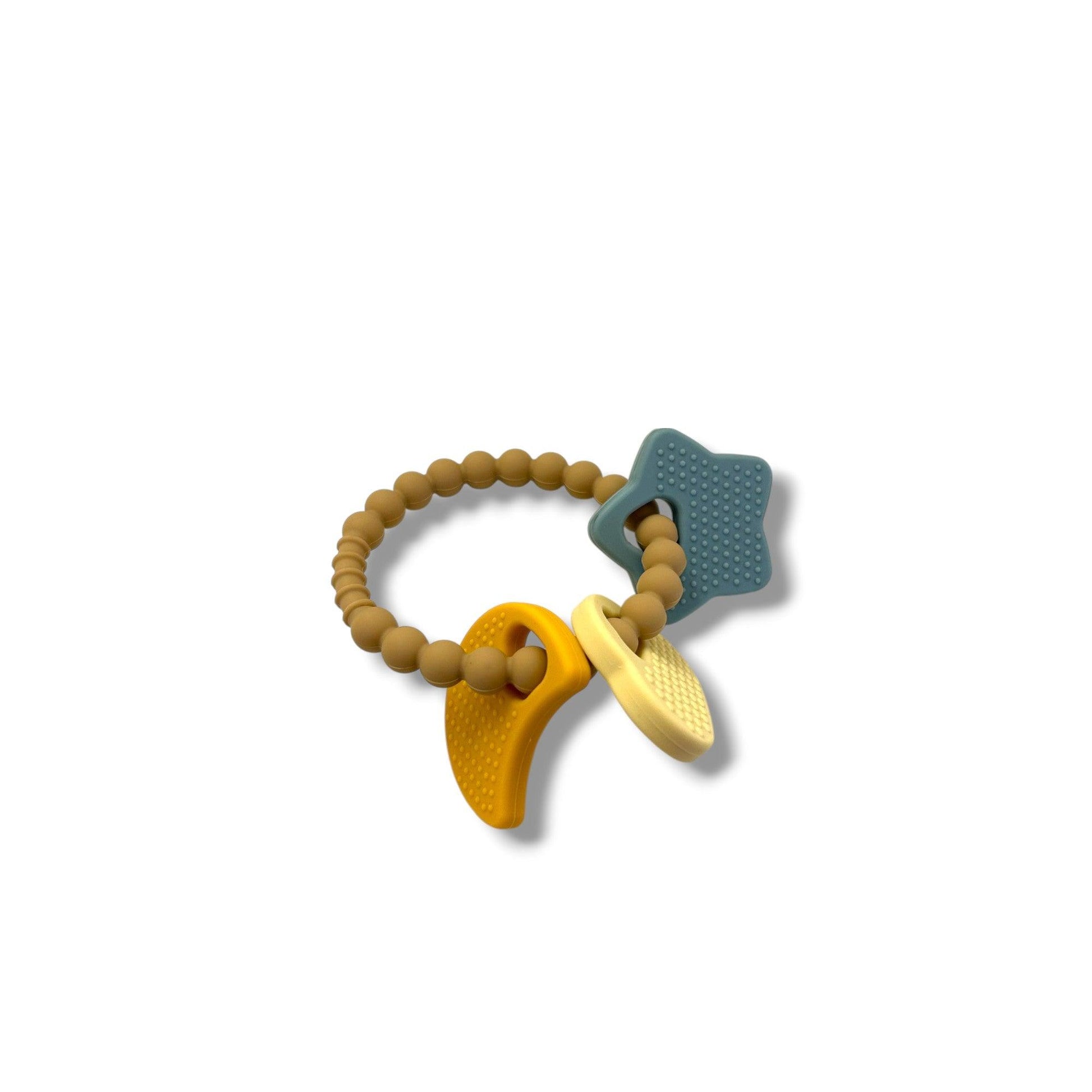 Teething ring with wooden moon and stars and colorful silicone shapes on a white background