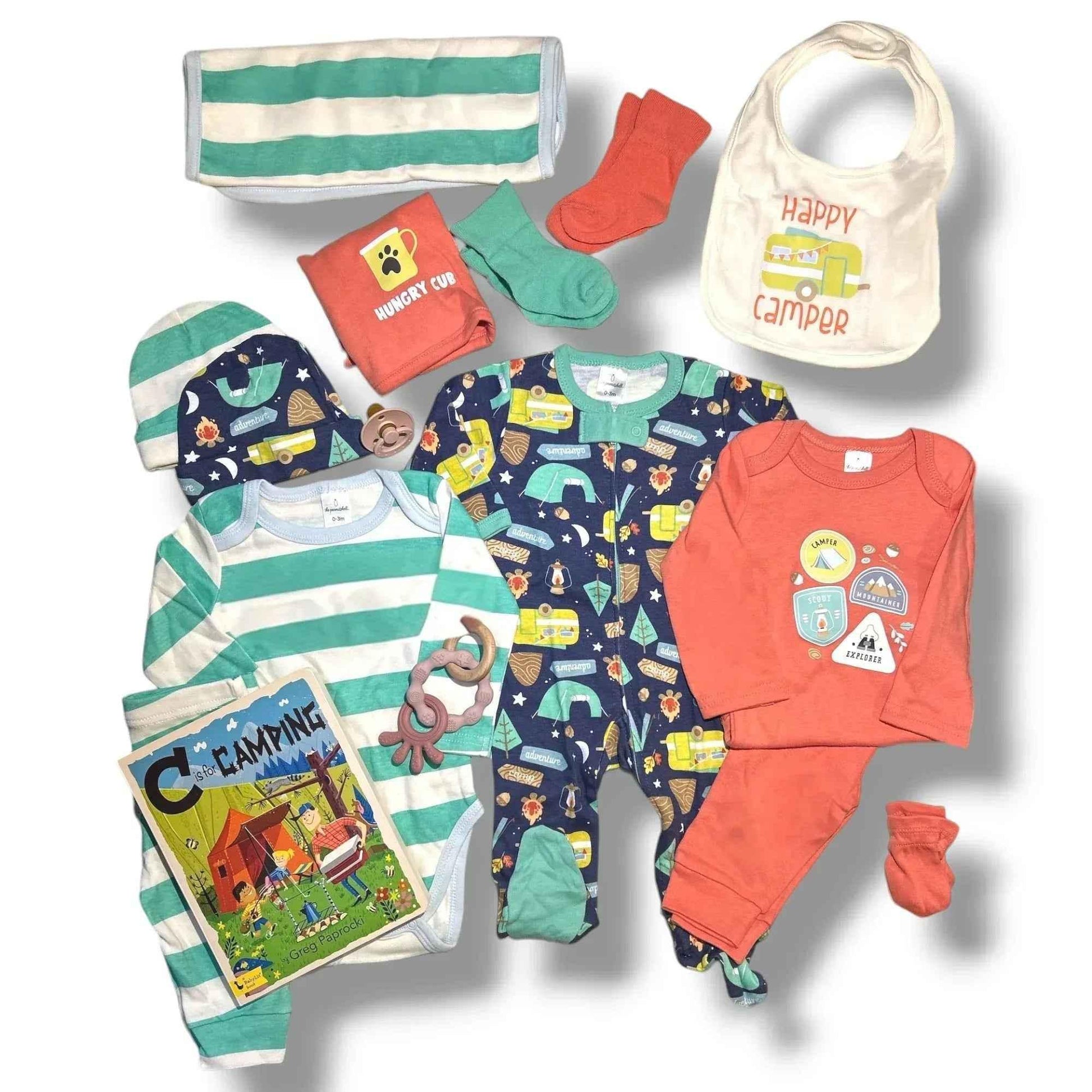 Camping-themed baby gift set with onesies, bib, socks, book, and teether for baby showers