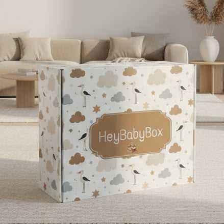 HeyBabyBox packaging with cloud and bird patterns on a neutral background