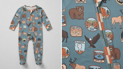 A children's long-sleeve footed one-piece pajama in a muted blue-gray color, covered in a detailed outdoor-themed print featuring bears, eagles, a moose, and various scenic patches. The left panel shows the full garment laid flat, and the right panel shows a close-up of the fabric pattern.