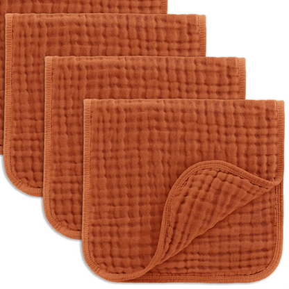 Set of orange textured cloths on a white background