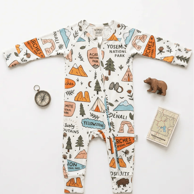 Children's onesie with national park designs on a white background
