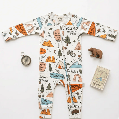 Children's onesie with national park designs on a white background