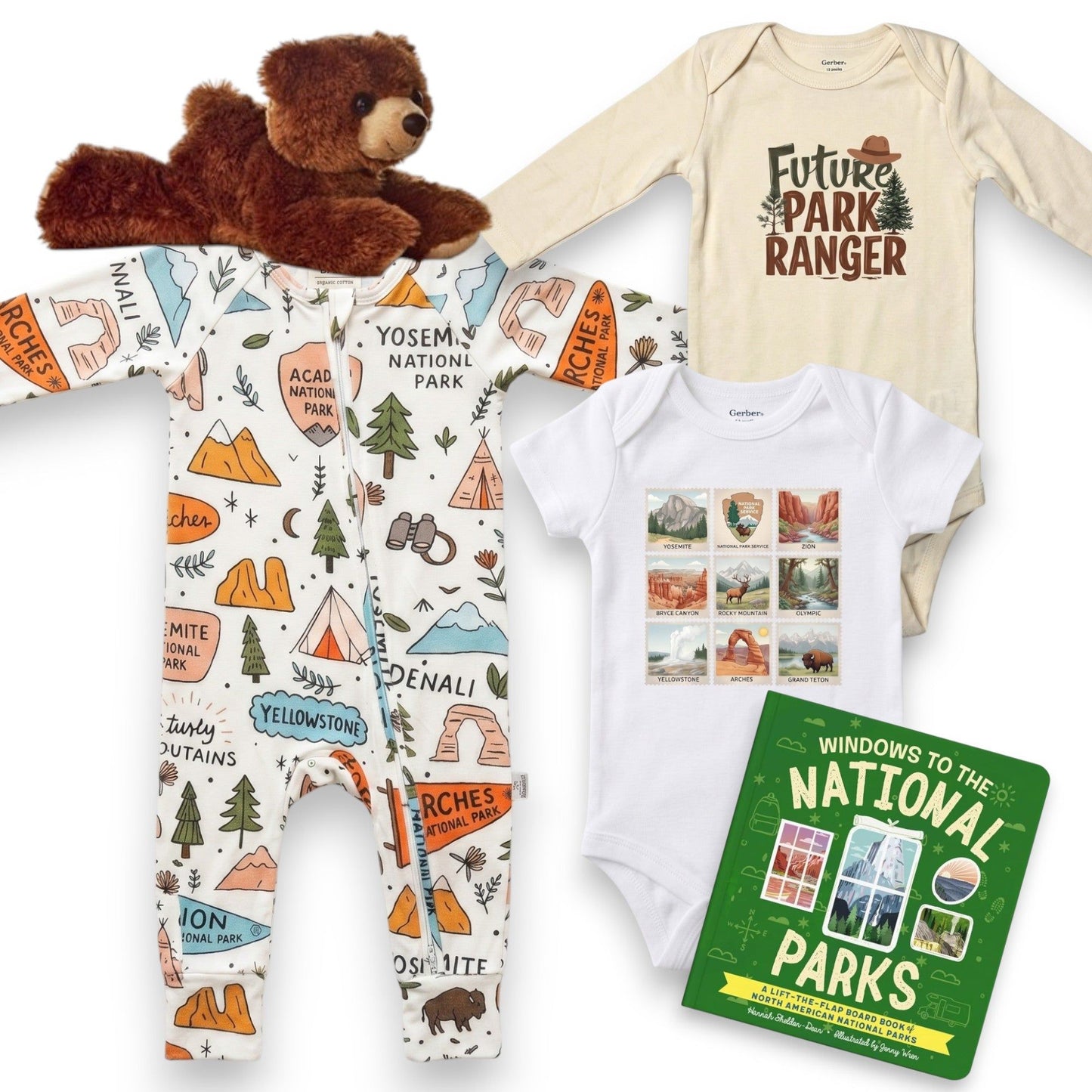 Baby onesie with national park design, teddy bear, and book on a white background