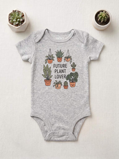 Gray baby onesie with plant-themed design on a light background