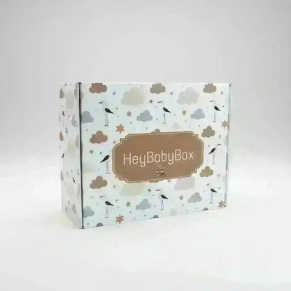 Hey Baby Box gift box with a golf theme, featuring storks, clouds, and stars. Ideal for baby showers and golf enthusiasts.