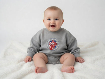 Hey Baby Box grey long-sleeve baby onesie with The Rolling Stones lips logo and Union Jack detail.