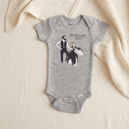 A heather gray baby bodysuit featuring a graphic print of the band Fleetwood Mac with the text 'Fleetwood Mac Rocks' and an illustration of the band members, laid flat on a cream-colored textured blanket.