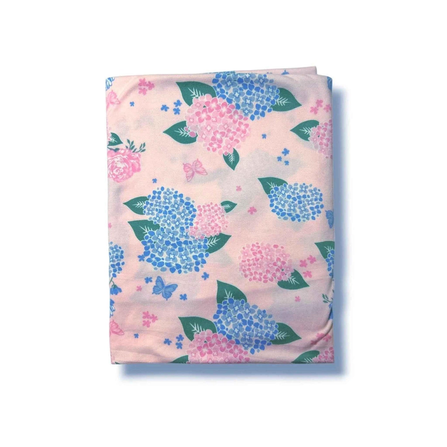 Pink floral blanket with blue and pink hydrangeas, green leaves, and butterflies for baby nursery decor