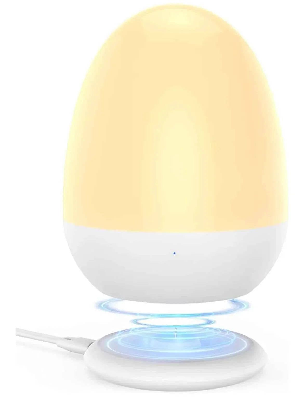 Egg-shaped night light with soft glow, wireless charging base, perfect for baby nursery or kids' room