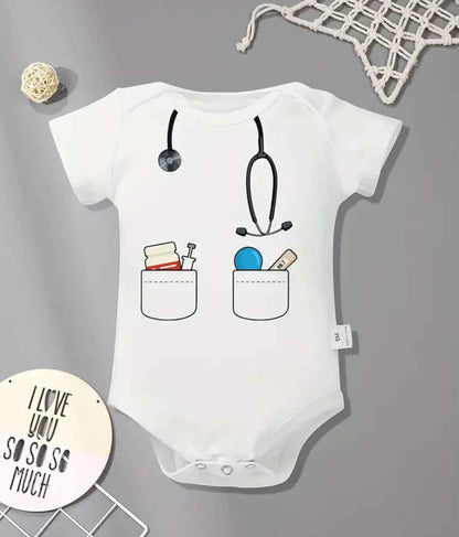 White baby onesie with stethoscope and medical pockets design, perfect for themed baby gifts