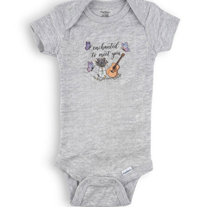 Gray baby onesie with musical design and text on a white background