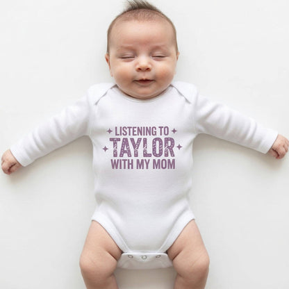 Baby wearing a white onesie with text on a white background