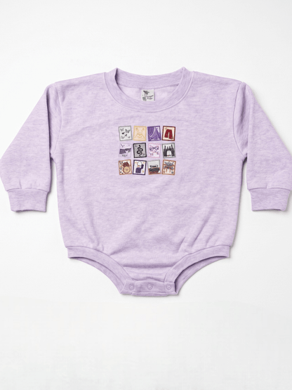 Purple baby onesie with colorful graphic on a white background