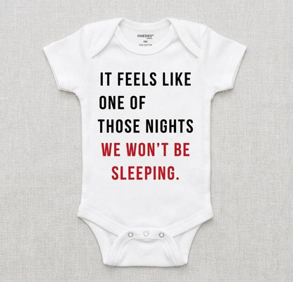 White baby onesie with humorous text on a gray background