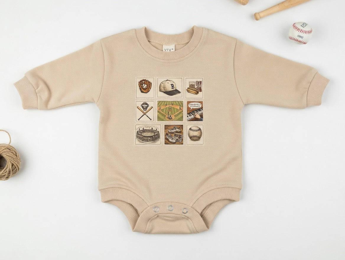 Beige baby onesie with graphic designs on a white background