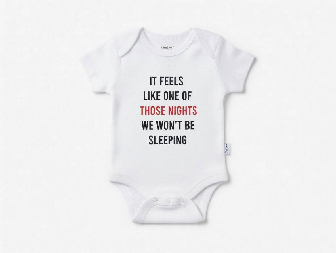 White baby onesie with humorous text on a white background