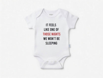 White baby onesie with humorous text on a white background