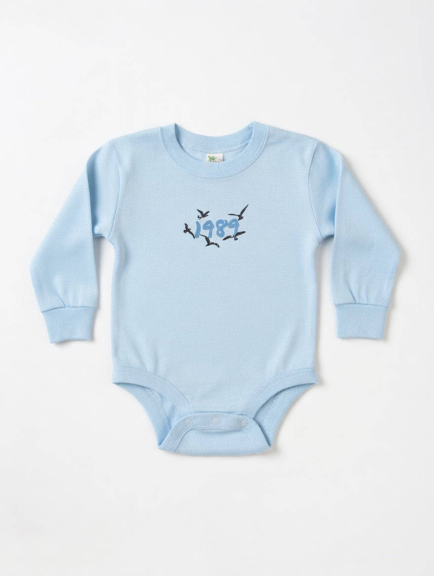 Light blue baby onesie with bird design on a white background