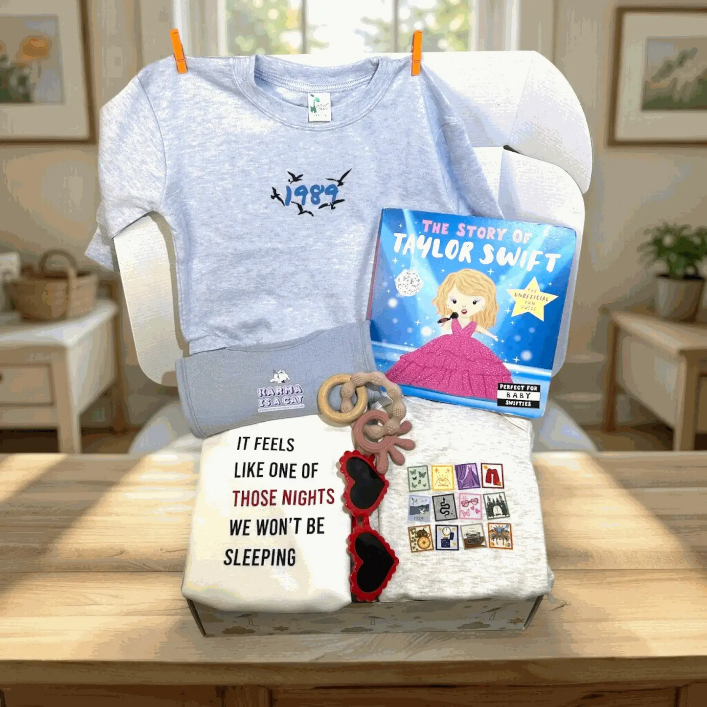 T-shirt with '1989' design, book titled 'The Story of Taylor Swift', and decorative items on a table.