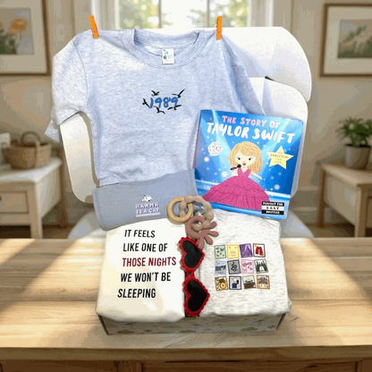 T-shirt with '1989' design, book titled 'The Story of Taylor Swift', and decorative items on a table.